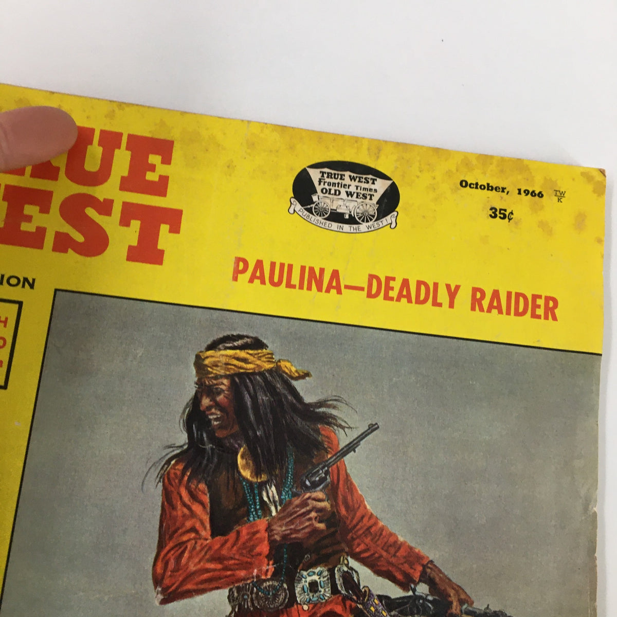 Close-up of the cover of True West Magazine, October 1966, showcasing the title 'Paulina - Deadly Raider' along with a vibrant image of a Native American, emphasizing the magazine's vintage aesthetic.