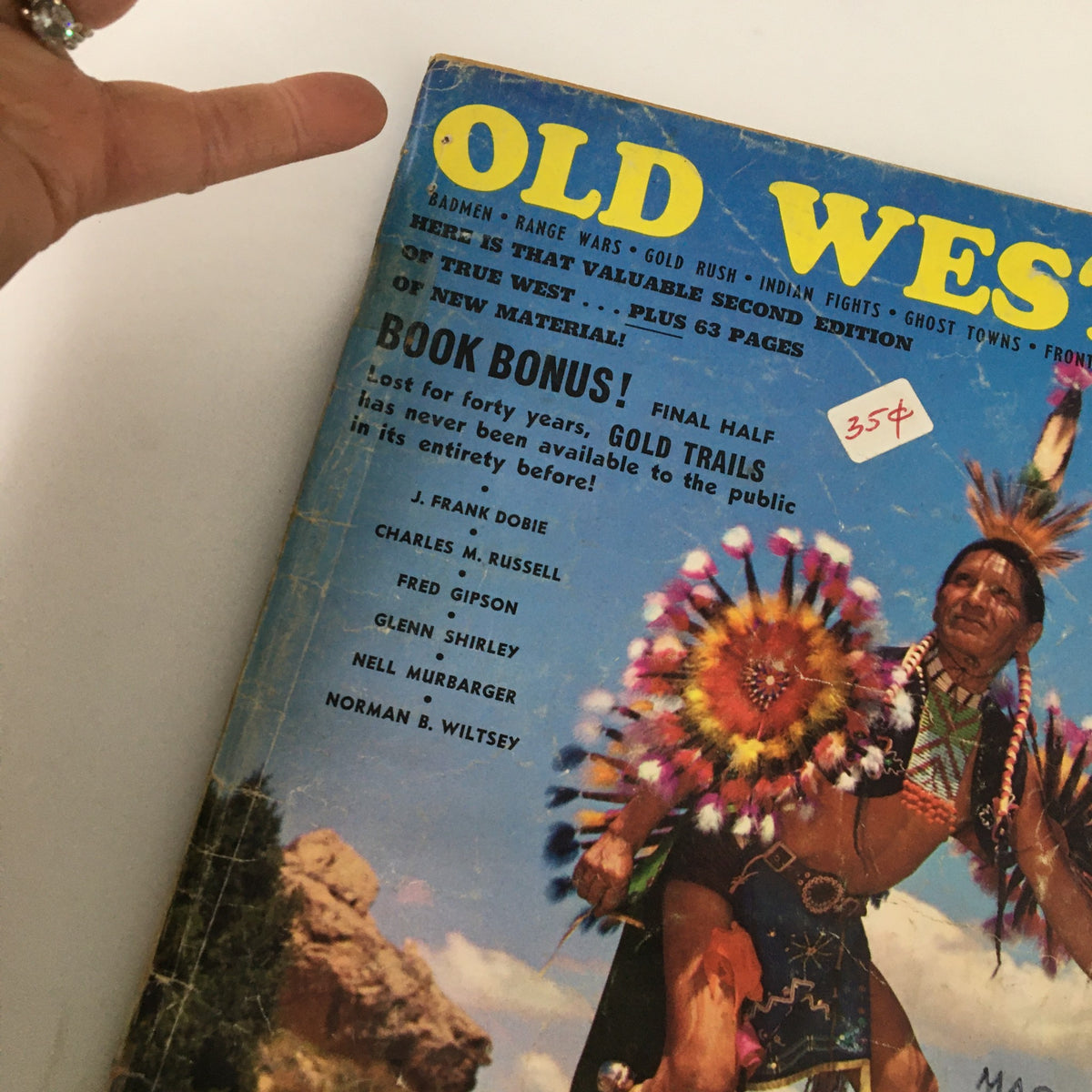 Close-up of the cover of VTG Old West Magazine Spring 1965, Volume 1, Issue 3 highlighting the mesmerizing artwork and text detailing 'The Most Dangerous Game' alongside notable contributors.