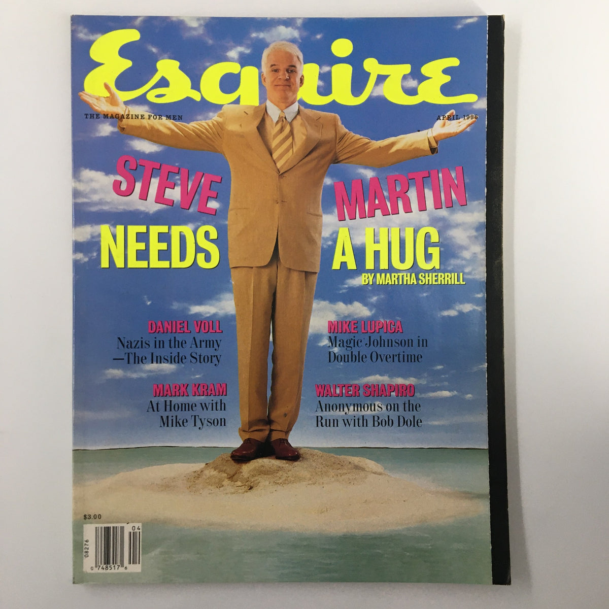 Cover of Esquire Magazine April 1996 Vol. 125 No. 4 featuring Steve Martin Needs A Hug. The vibrant cover showcases Steve Martin in a beige suit with arms outstretched, embodying the playful spirit of the 90s.