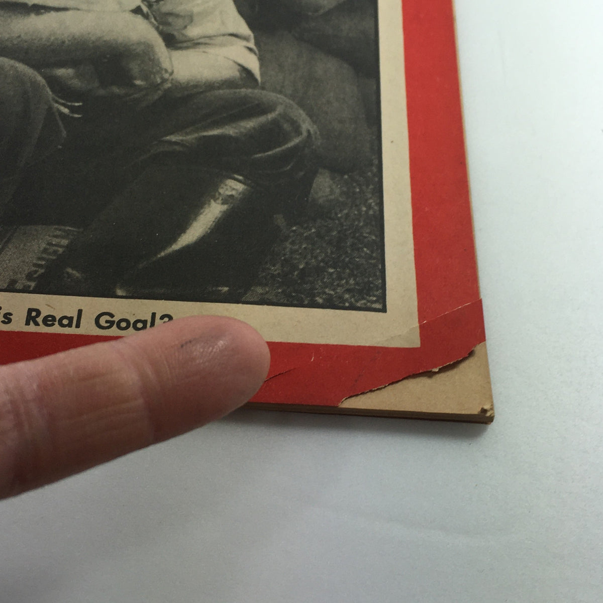 Close-up view of the edge of a vintage Newsweek Magazine from January 12, 1948, highlighting wear and tear on the cover while maintaining historical significance.