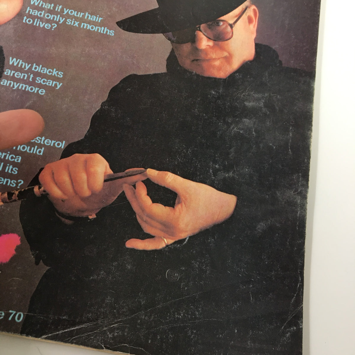 Close-up of the cover of VTG Esquire Magazine May 1976, highlighting the article titles and a stylized image related to Truman Capote.
