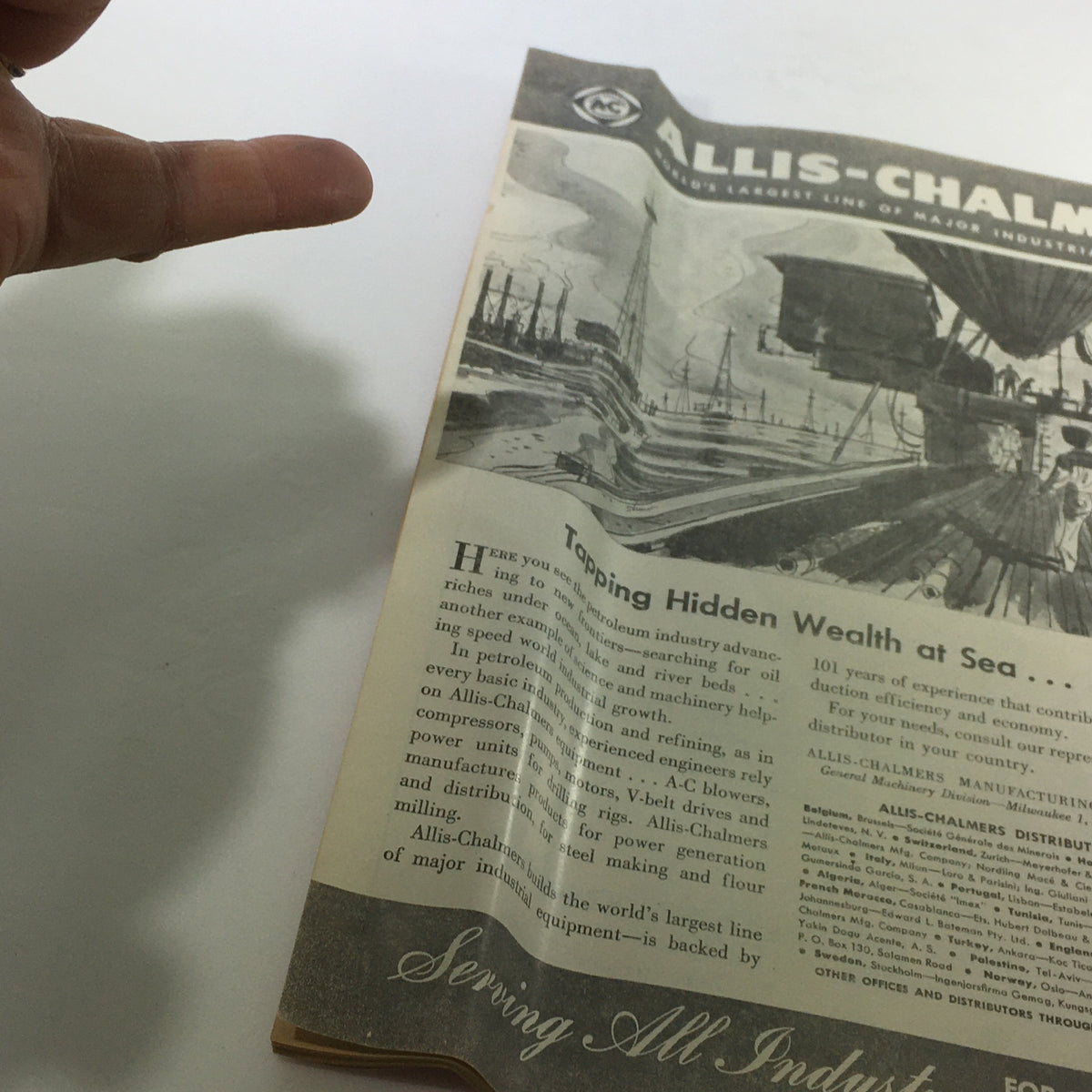 Interior page of VTG Newsweek Magazine featuring an advertisement for Allis-Chalmers, illustrating the company's involvement in modern industry and petroleum advancements.