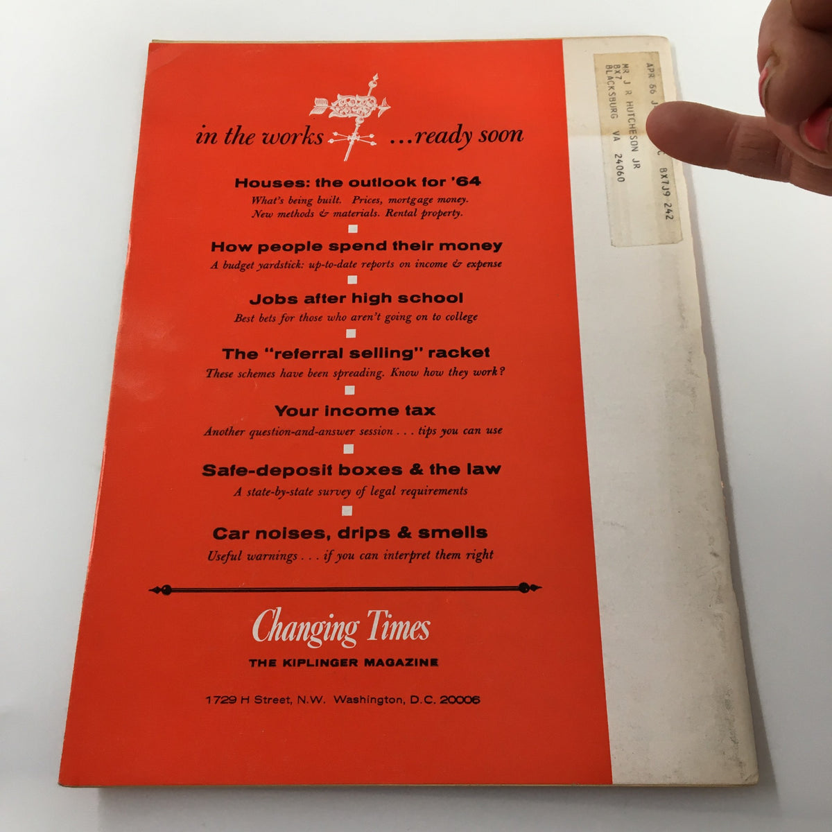 Back cover of VTG Changing Times Magazine February 1964, featuring a bright orange design with promotional details about upcoming articles and magazine services.