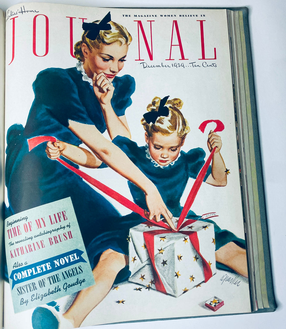 Cover of Ladies' Home Journal December 1939 illustrating a woman and child opening a gift. Part of the complete collection for the year 1939, from January to December.