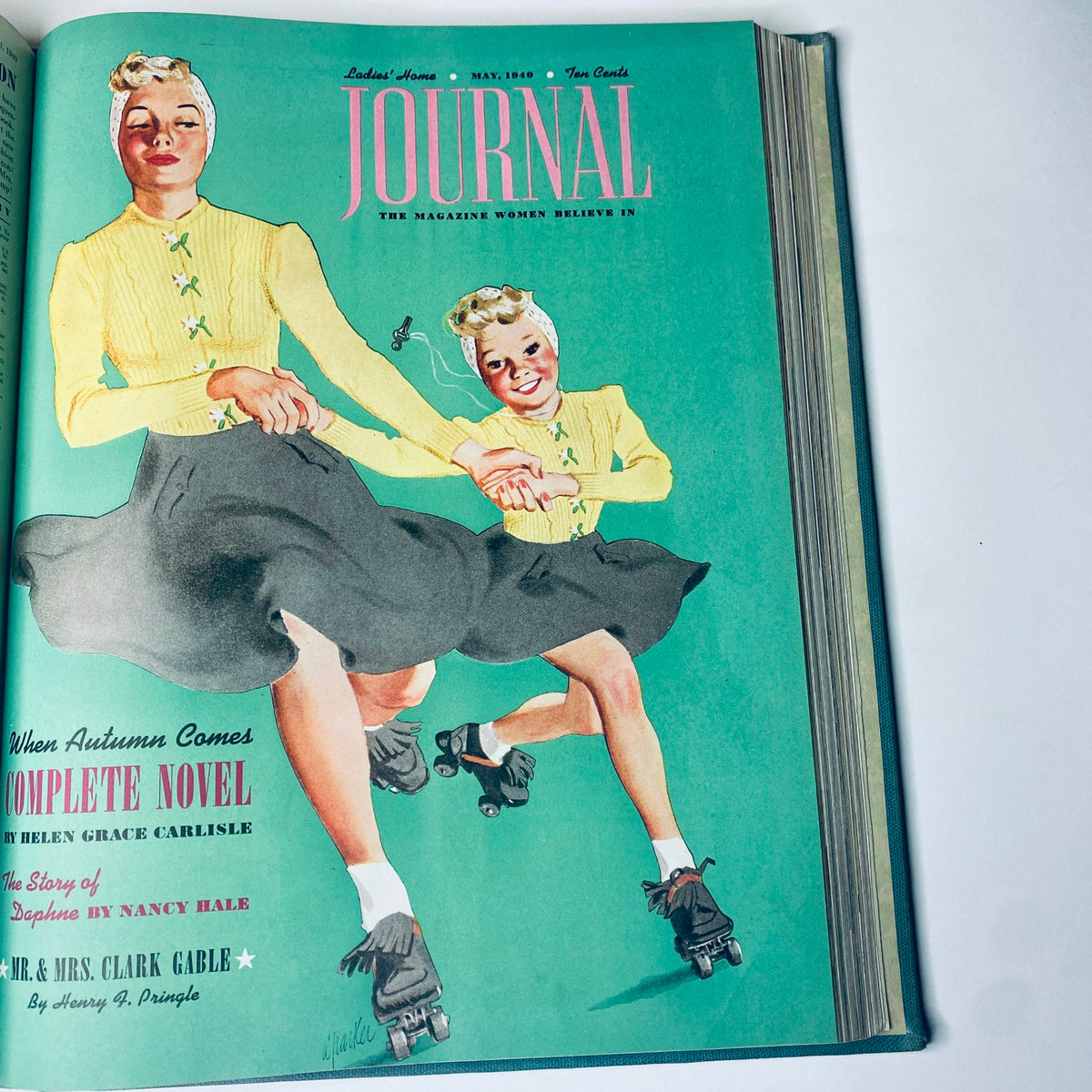 Cover of Ladies' Home Journal May 1940, highlighting women roller-skating in bright clothing, capturing playful moments from 1940s American family life.