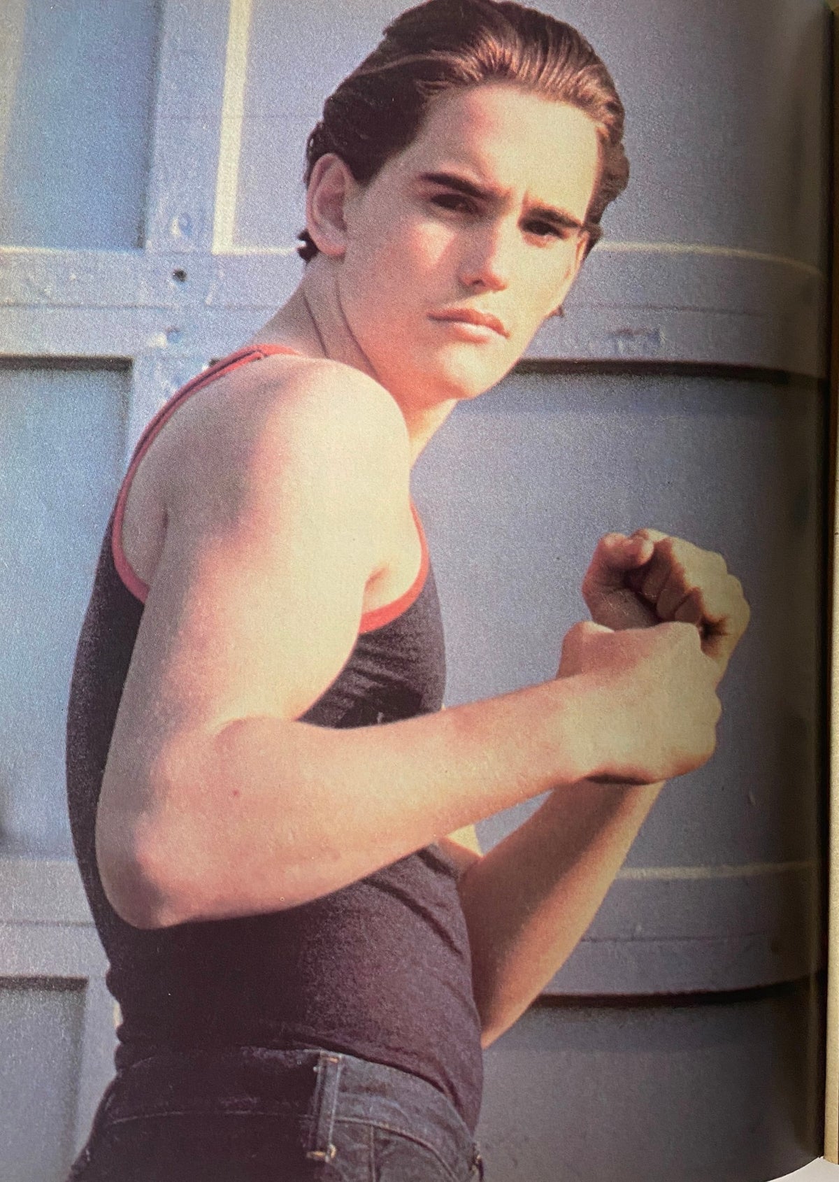 Image of a young male model from Tiger Beat Magazine July 1980, posing in a tank top with a serious expression.
