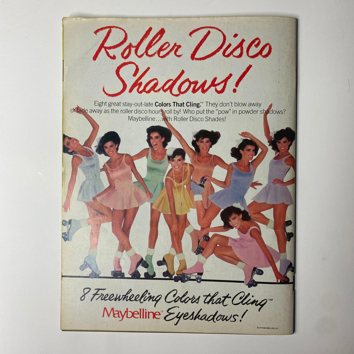 Back cover of a promotional publication for Maybelline's Roller Disco Shadows, showcasing models in vibrant outfits and roller skates.