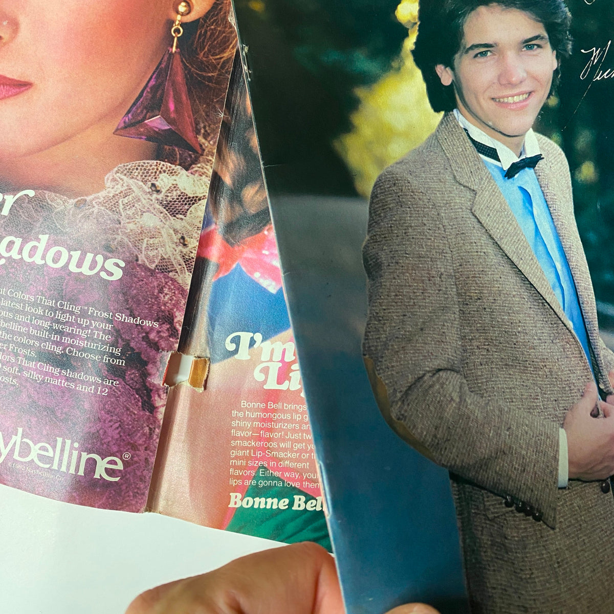 Inside spread from Tiger Beat Magazine September 1982 showcasing advertisements and celebrity features, including a picture of a young male star in a stylish outfit.