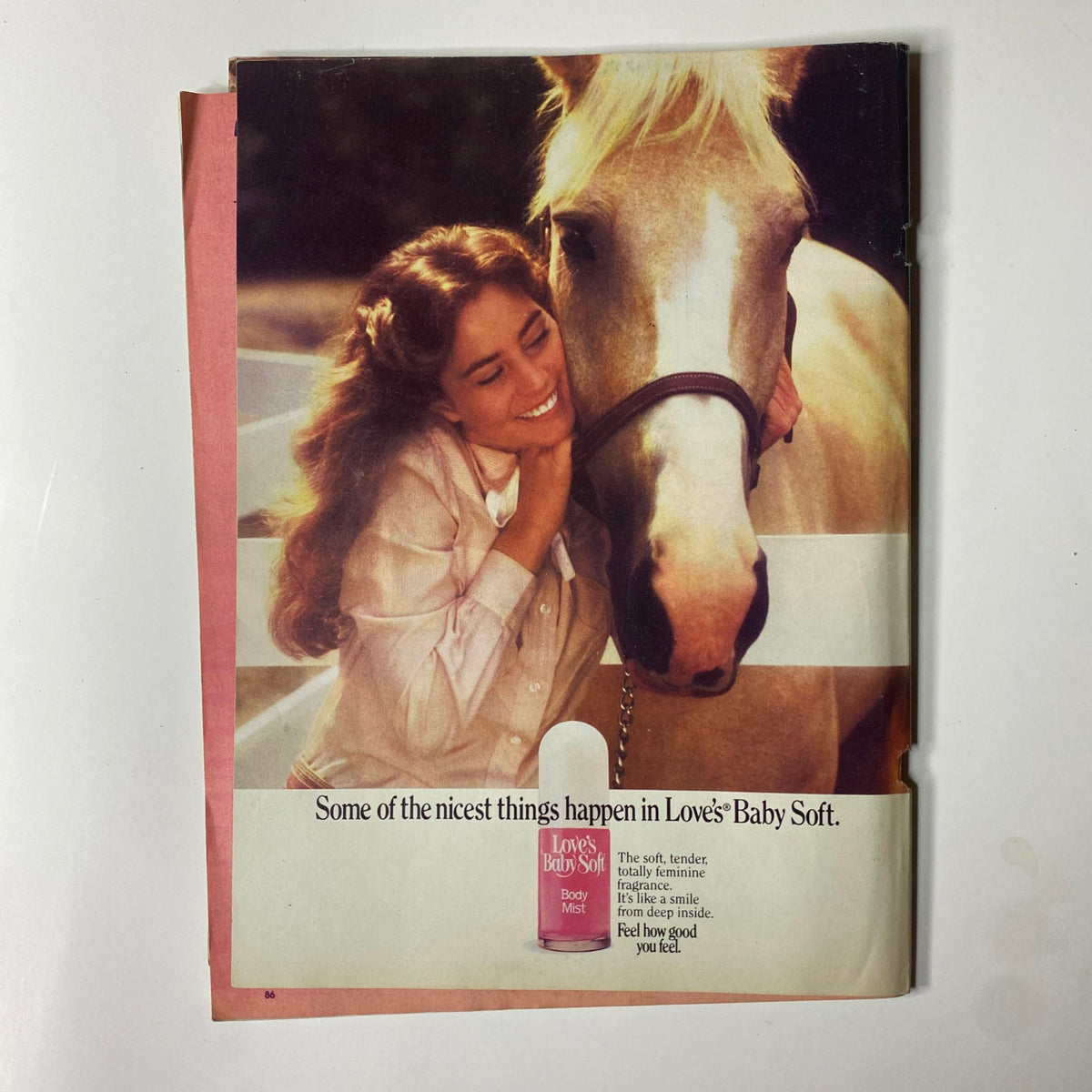 Tiger Beat Magazine September 1982 advertisement for Love's Baby Soft body mist, showing a smiling woman with a horse, highlighting a nostalgic fragrance.