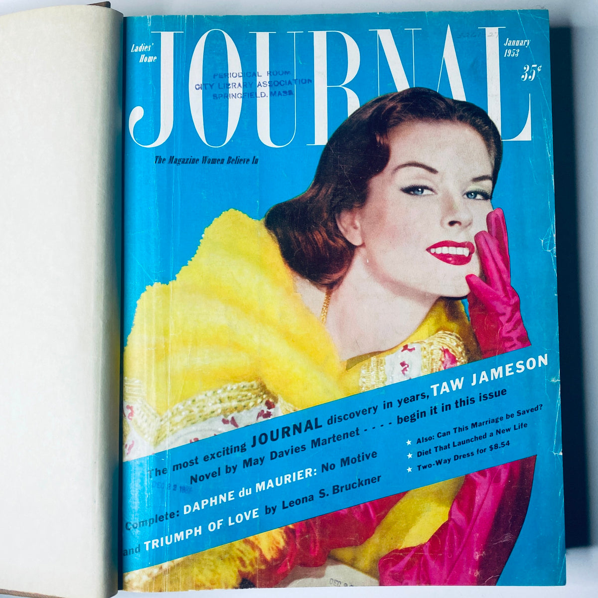 January 1953 cover of Ladies' Home Journal, showcasing a glamorous woman in a yellow coat and pink gloves. The magazine features articles on relationships, novels, and fashion. This image is part of the Ladies' Home Journal Library Bound Magazine 1953 Full Year January - December.