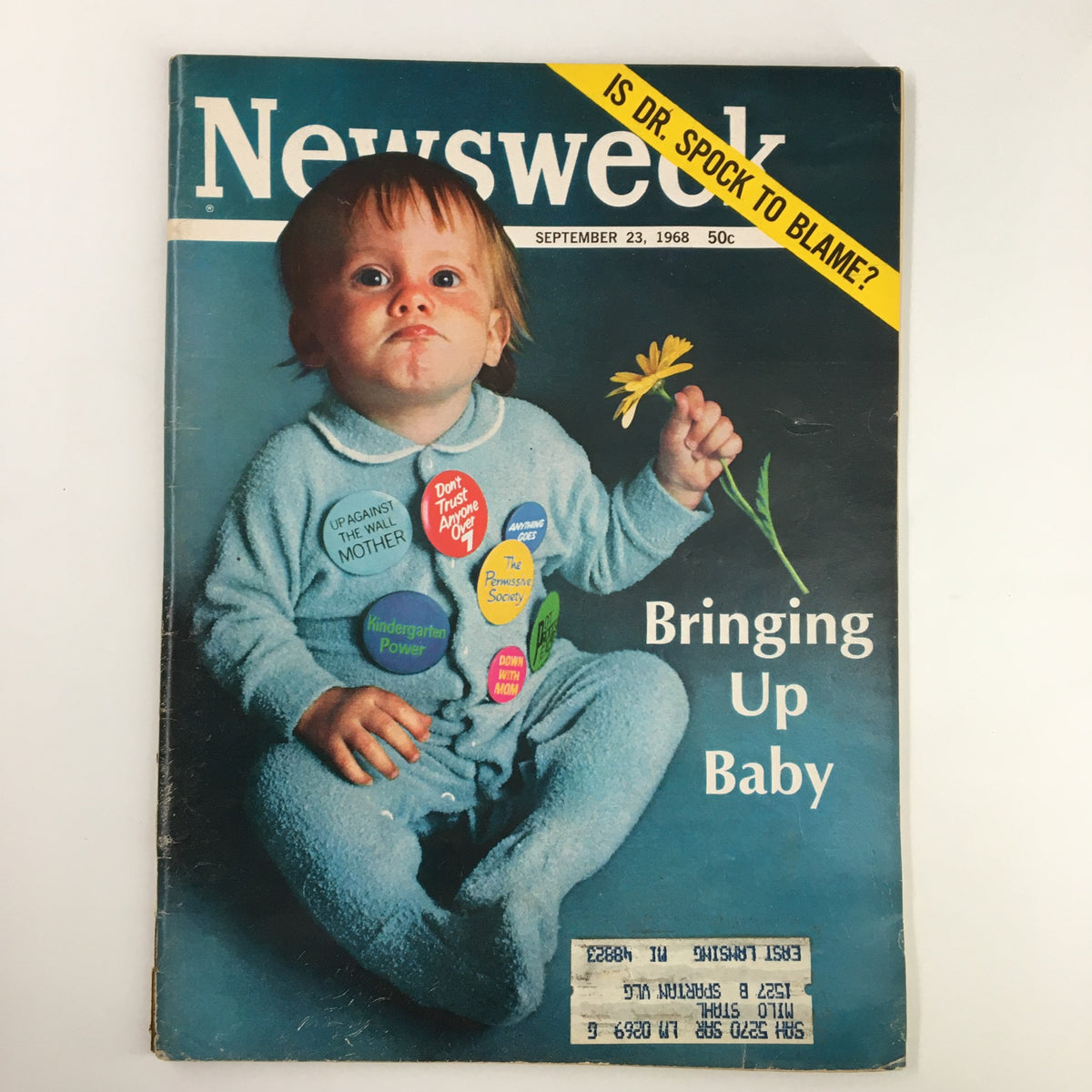 Vintage Newsweek magazine cover from September 23, 1968, featuring a child in blue pajamas holding a flower, with the title 'Bringing Up Baby, Is Dr. Spock To Blame?' and colorful stickers addressing parenting concerns.