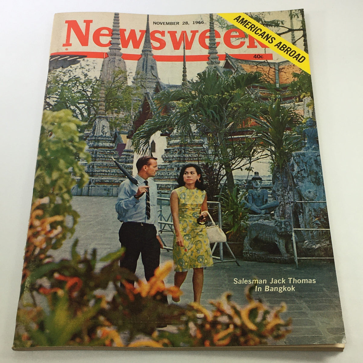 VTG Newsweek Magazine November 28 1966 featuring Salesman Jack Thomas, showcasing a vintage cover illustration of a couple in Bangkok amidst lush greenery and ornate architecture, highlighting 'Americans Abroad'