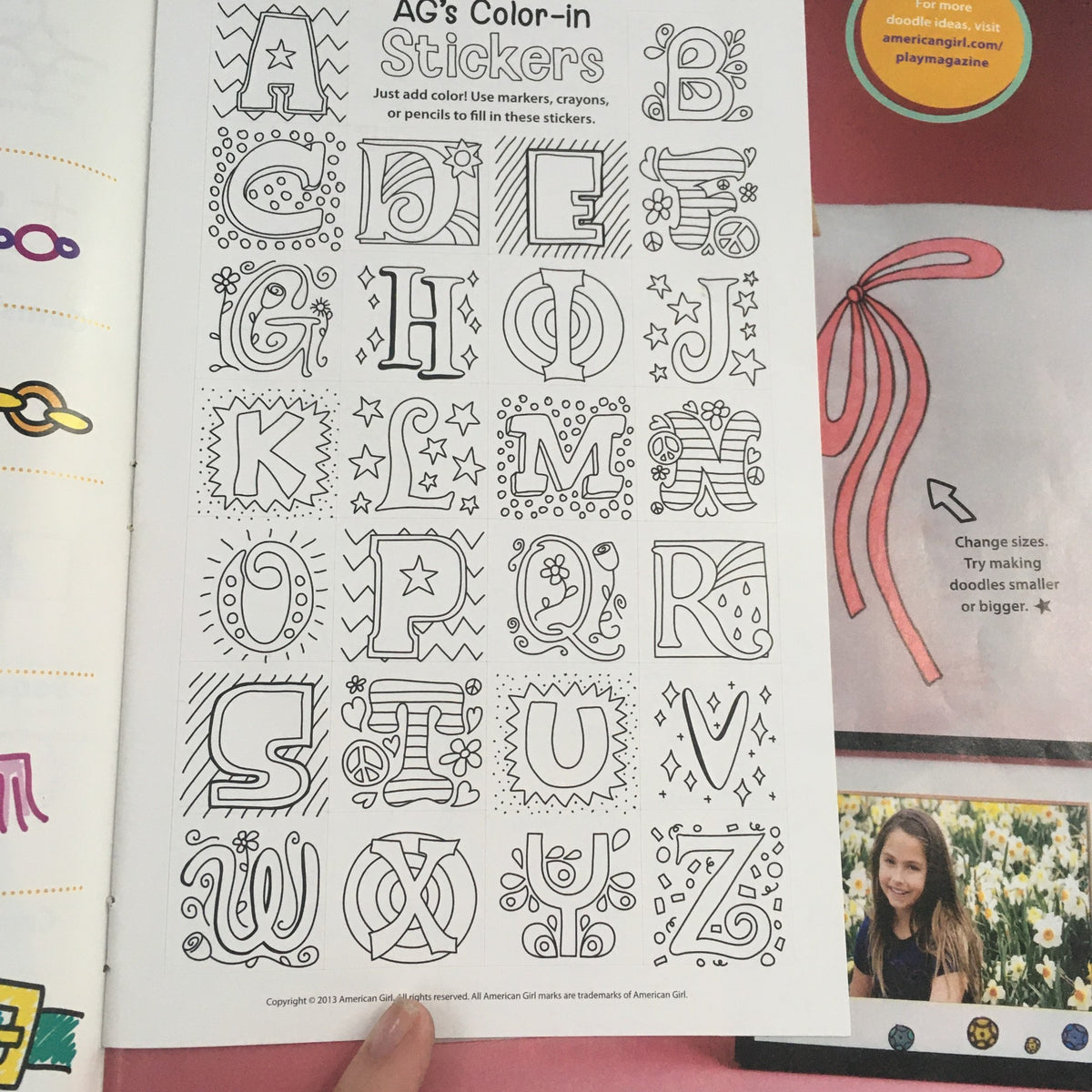 Page from American Girl Magazine May 2013 displaying AG's Color-in stickers, encouraging creativity with drawn designs for coloring.