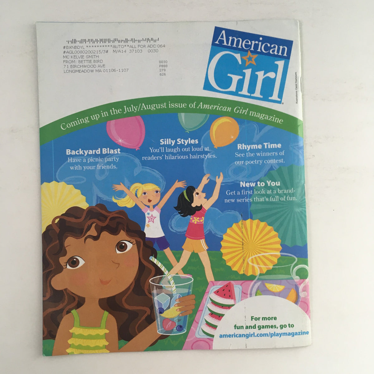 Back cover of American Girl Magazine May 2013 featuring a colorful illustration of girls enjoying summer activities. Contains details about the upcoming July/August issue.