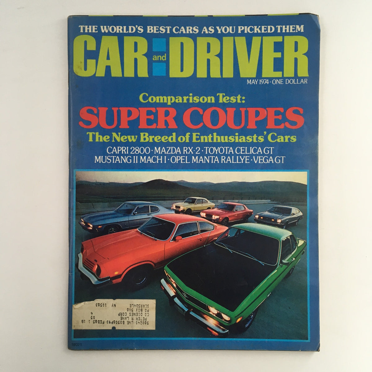 Cover of Car and Driver Magazine from May 1974 featuring a Comparison Test of super coupes: Capri 2800, Mazda RX-2, Toyota Celica GT. The cover showcases multiple colorful classic cars parked on an open road, highlighting the car culture of the 1970s.