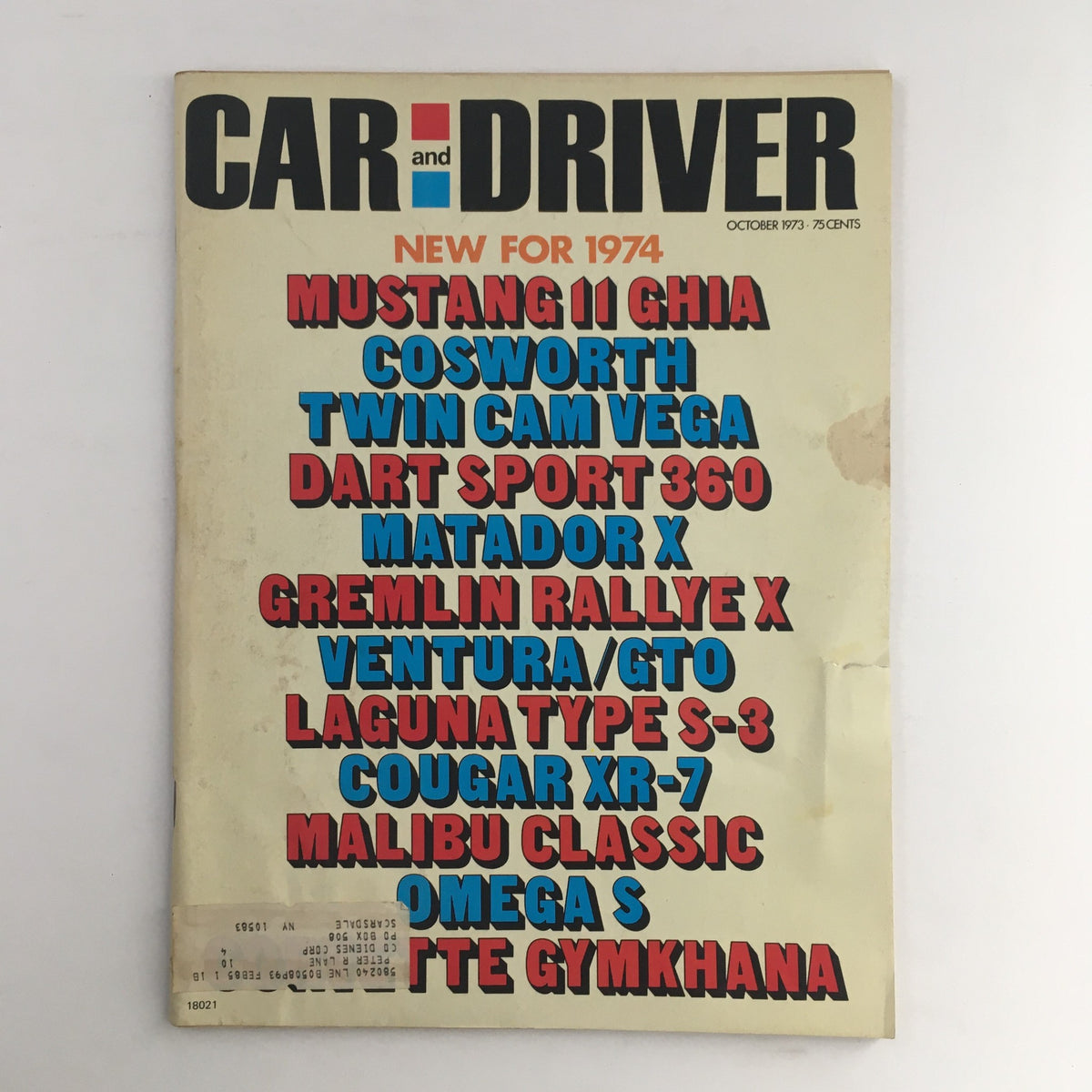 Cover of Car and Driver Magazine, October 1973 edition featuring the Mustang II Ghia, Cosworth, and Twin Cam Vega, highlighting new cars for 1974.