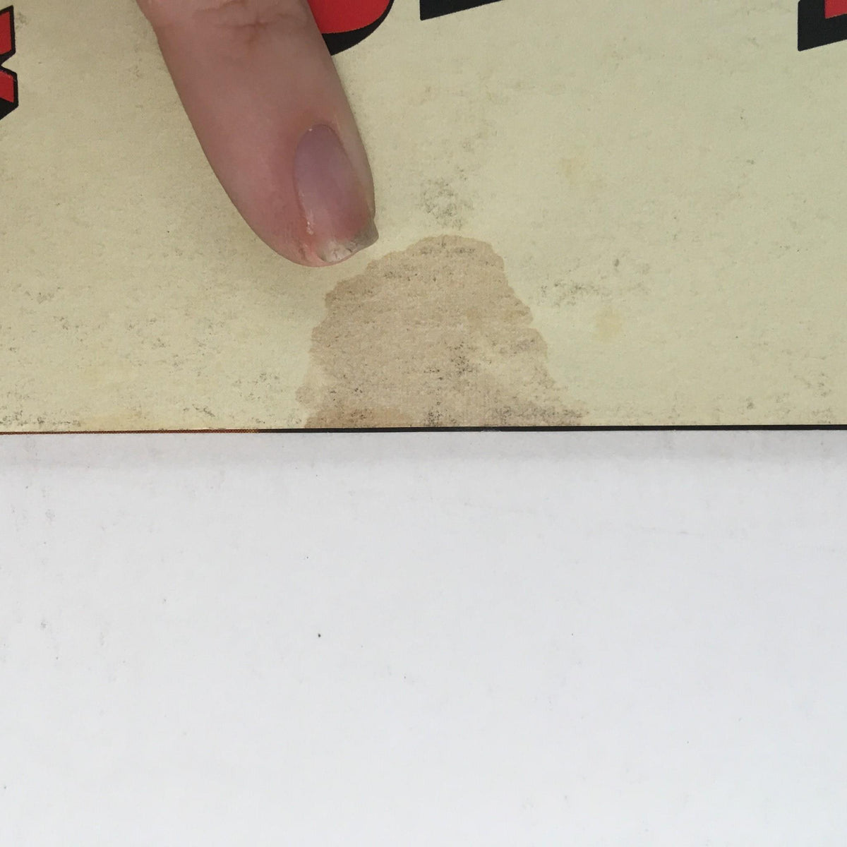 Another close-up of the October 1973 Car and Driver Magazine covering a stain near the bottom, detailing the magazine's vintage condition and history.