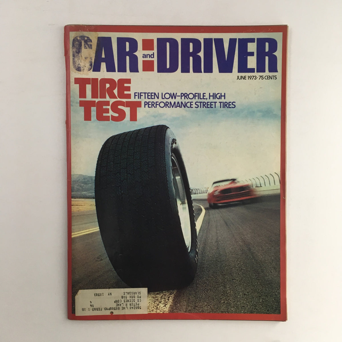 Cover of Car and Driver Magazine, June 1973 issue featuring a tire test of performance street tires, showcasing a striking image of a car tire with a blurred race car in the background.