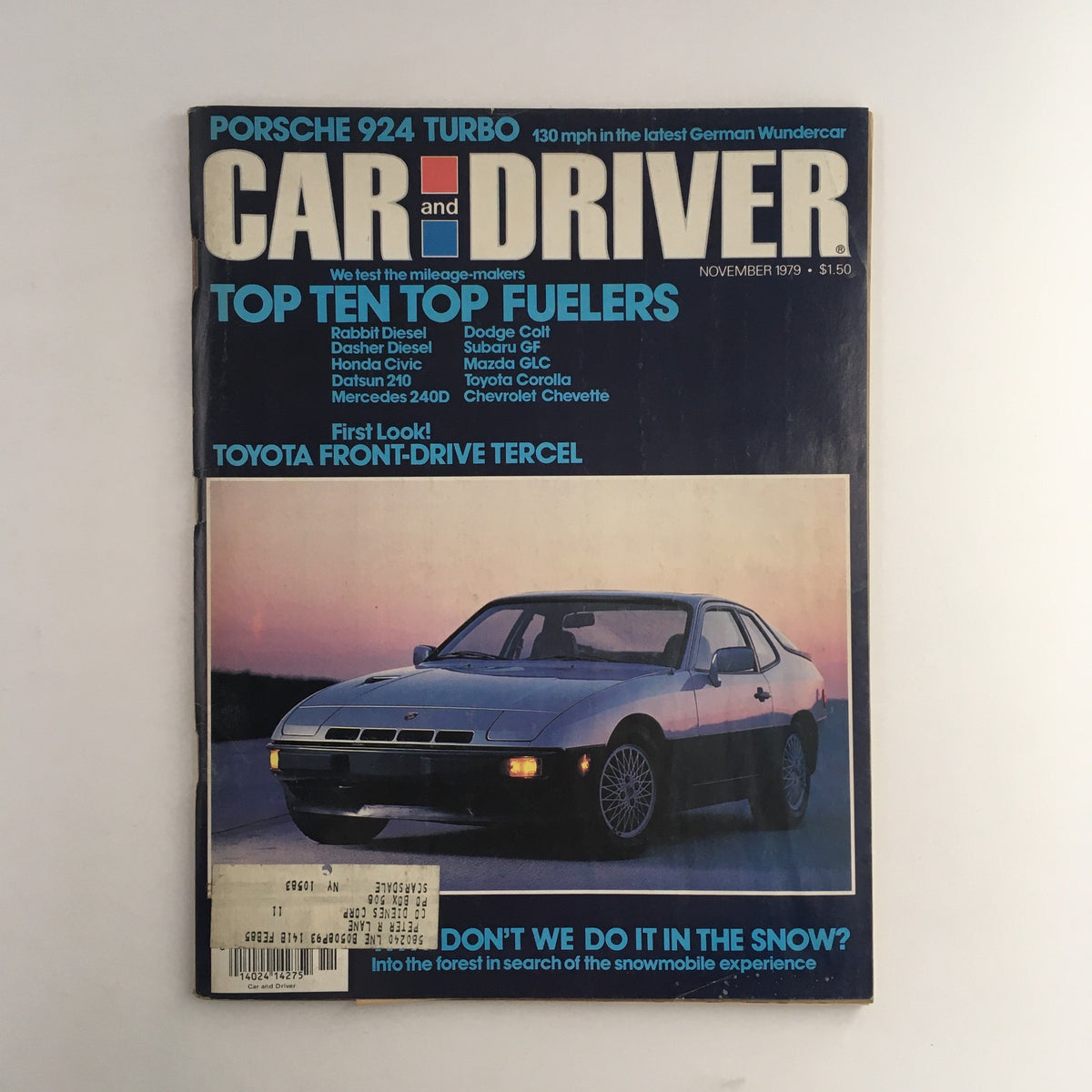 Car and Driver Magazine November 1979 featuring Porsche 924 Turbo and Toyota F-Drive Tercel on the cover, showcasing the iconic sports car design with a backdrop of vibrant colors.
