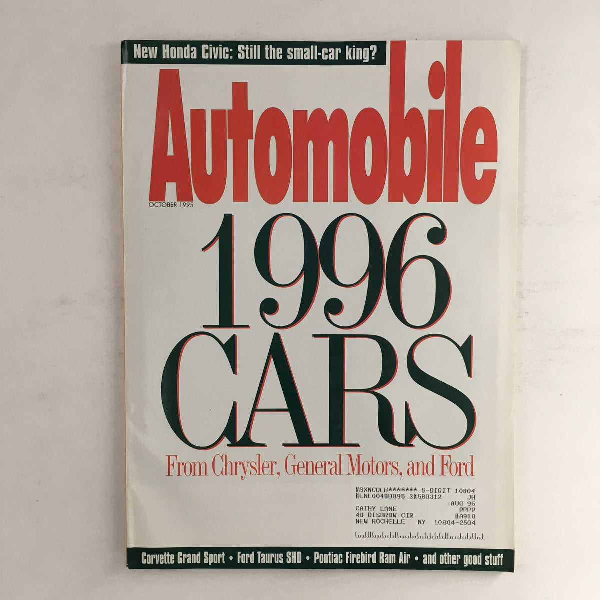 Automobile Magazine October 1995 cover featuring Corvette Grand Sport and Ford Taurus SHD, displaying the title 'Automobile 1996 CARS' and highlighting classic American cars.