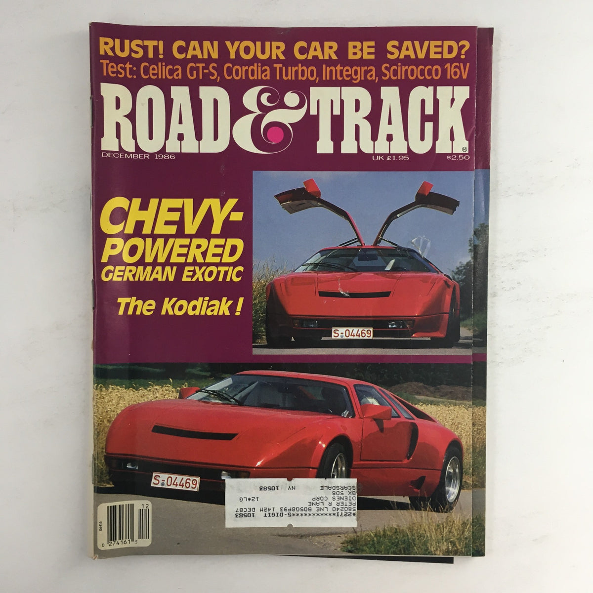 Road & Track Magazine December 1986 cover featuring the Chevy-Powered German Exotic The Kodiak, showcasing a striking red sports car with distinctive design details.
