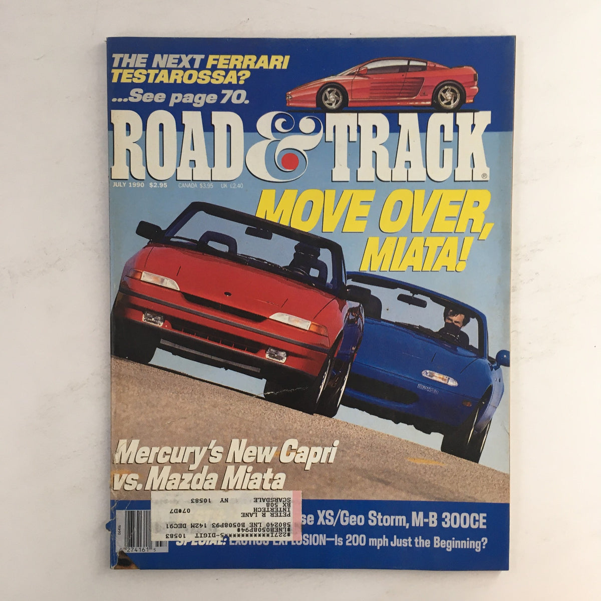 Cover of Road & Track Magazine July 1990 featuring a comparison of Mercury Capri vs Mazda Miata and the headline 'Move Over, Miata!'. The magazine showcases a vibrant image with two convertible cars and promotional text on automotive topics.