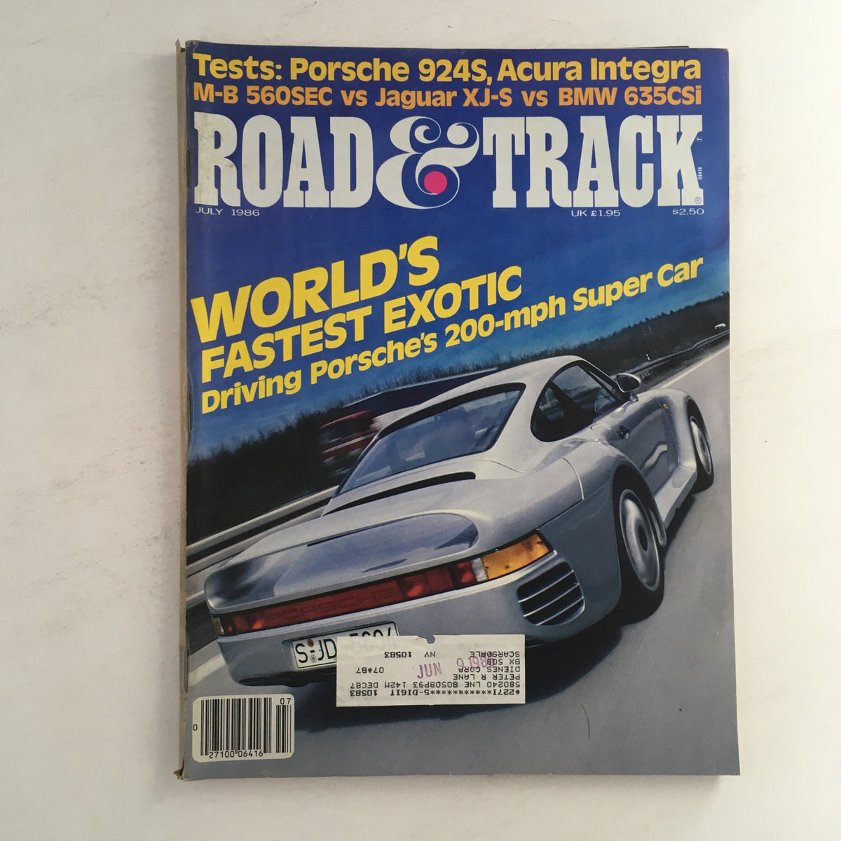 Cover of Road & Track Magazine July 1986 featuring road tests of Porsche 924S and Acura Integra. Bold text states 'World's Fastest Exotic' and highlights driving Porsche's 200-mph Super Car. Vintage automotive magazine collectible.