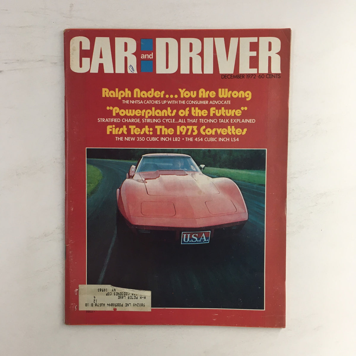 Cover of Car and Driver Magazine, December 1972, featuring the first test of the 1973 Corvettes with a striking red Corvette on the front, highlighting automotive history and performance insights.