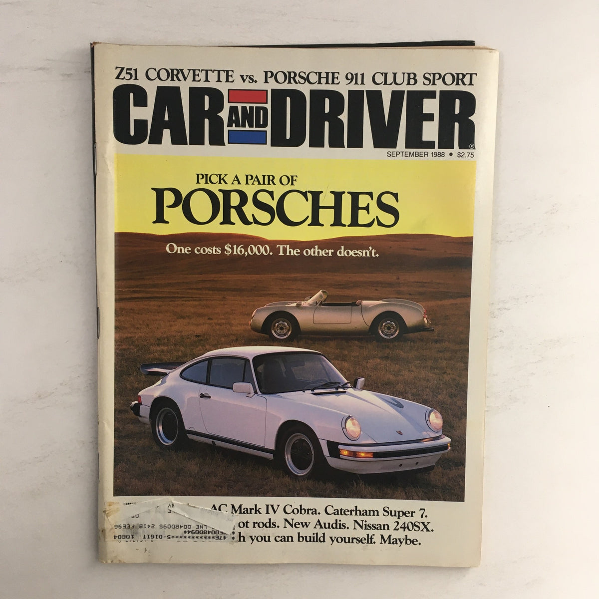 Cover of Car and Driver Magazine September 1988 featuring a comparison of the Z51 Corvette and Porsche 911 Club Sport, showcasing both iconic sports cars with a scenic background.