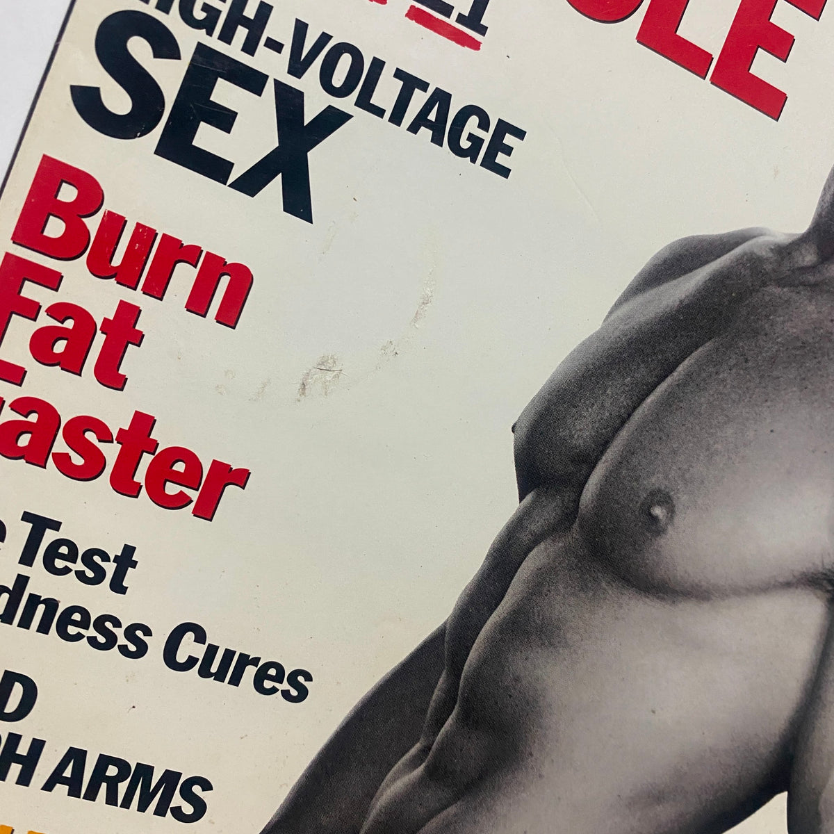 Close-up of the Men's Health Magazine June 1999 cover, displaying bold text about 'Max Muscle', 'High-Voltage Sex', and 'Burn Fat Faster', emphasizing health and fitness topics.