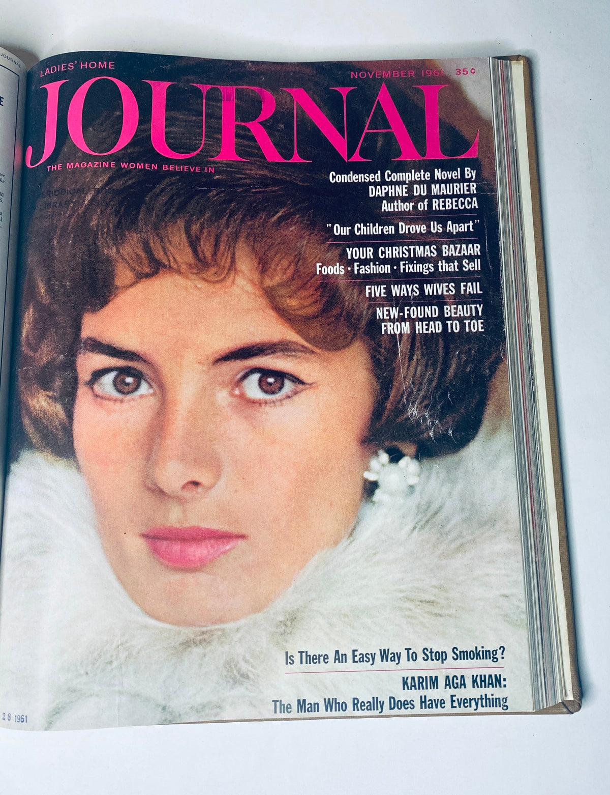 Ladies' Home Journal Bound Magazine, November 1961 issue displaying a close-up portrait of a glamorous woman in white fur, promoting beauty and fashion.