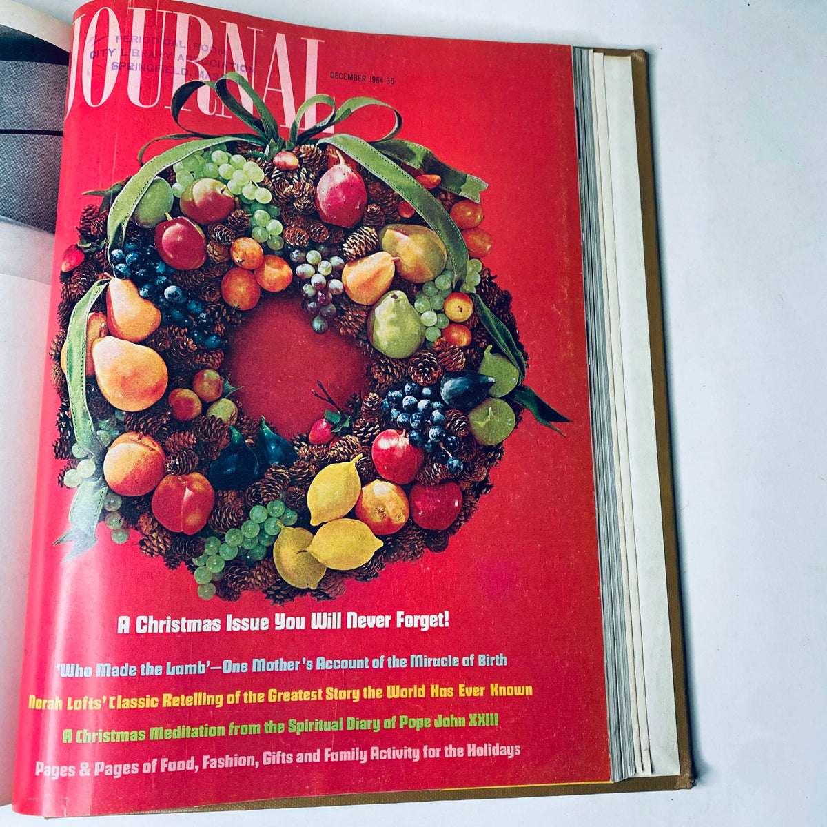 Ladies' Home Journal Bound Magazine 1964 - December issue cover showcasing a festive holiday wreath, emphasizing Christmas themes and seasonal topics.