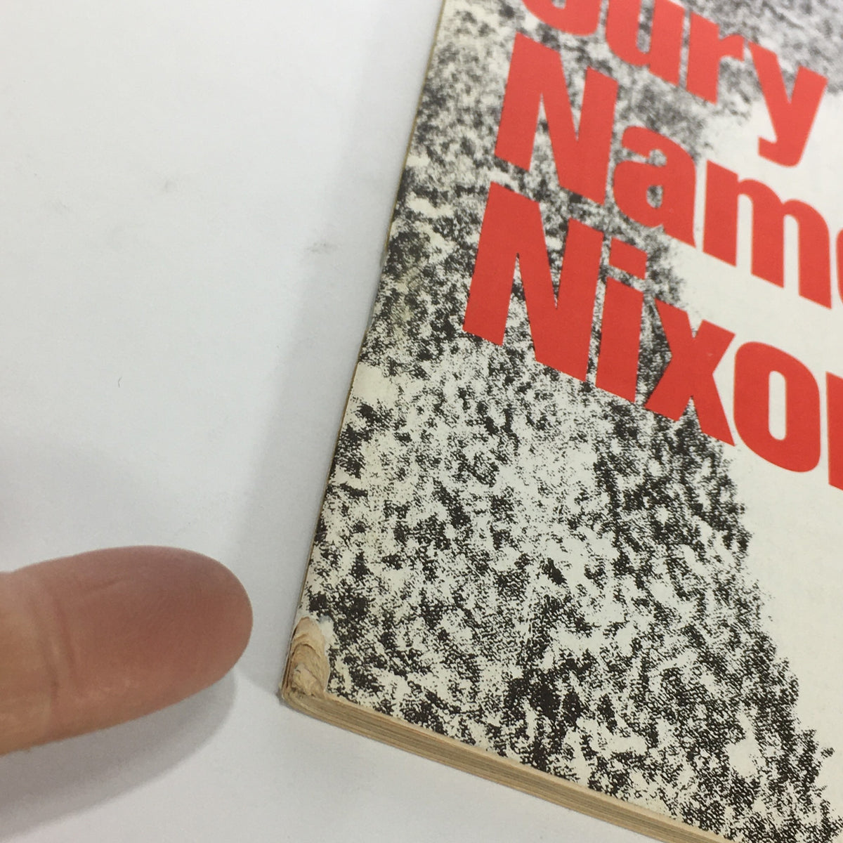 Close-up view of the edge of the VTG Newsweek Magazine June 17 1976, highlighting the title 'The Jury Names Nixon' with visible wear on the corner.