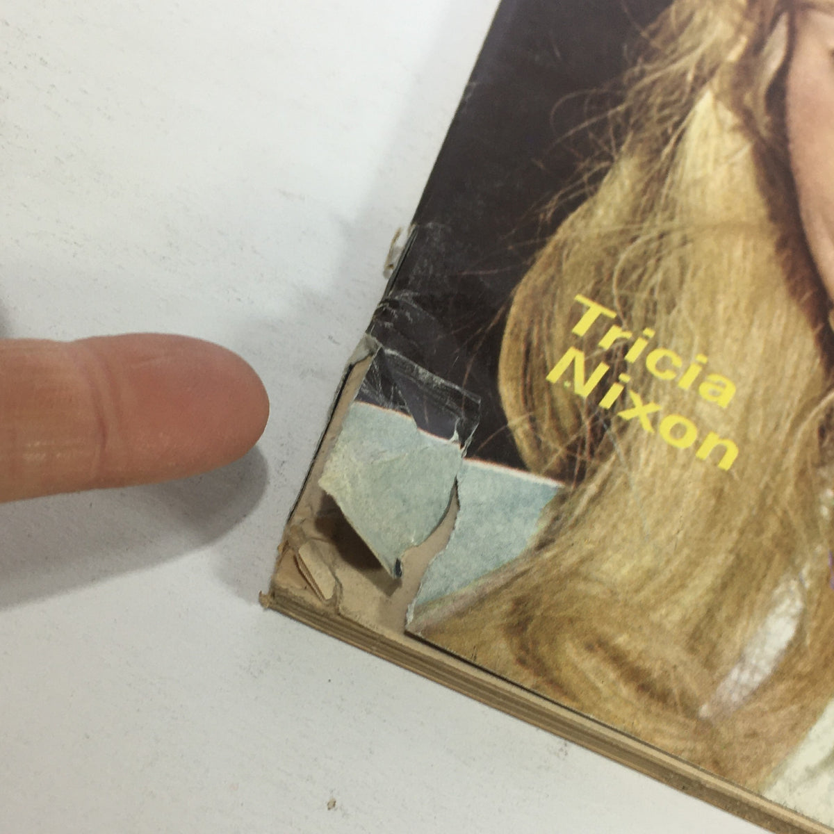 Close-up view of the edge of the vintage Newsweek magazine from June 14, 1971, showing wear and a tear, highlighting Tricia Nixon's wedding feature.