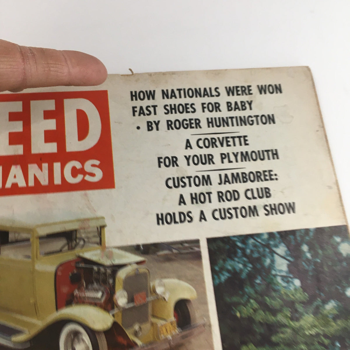 Close-up of the Speed Mechanics Magazine February 1960 cover, highlighting article titles such as 'A Corvette For Your Plymouth' and featuring images of classic cars.