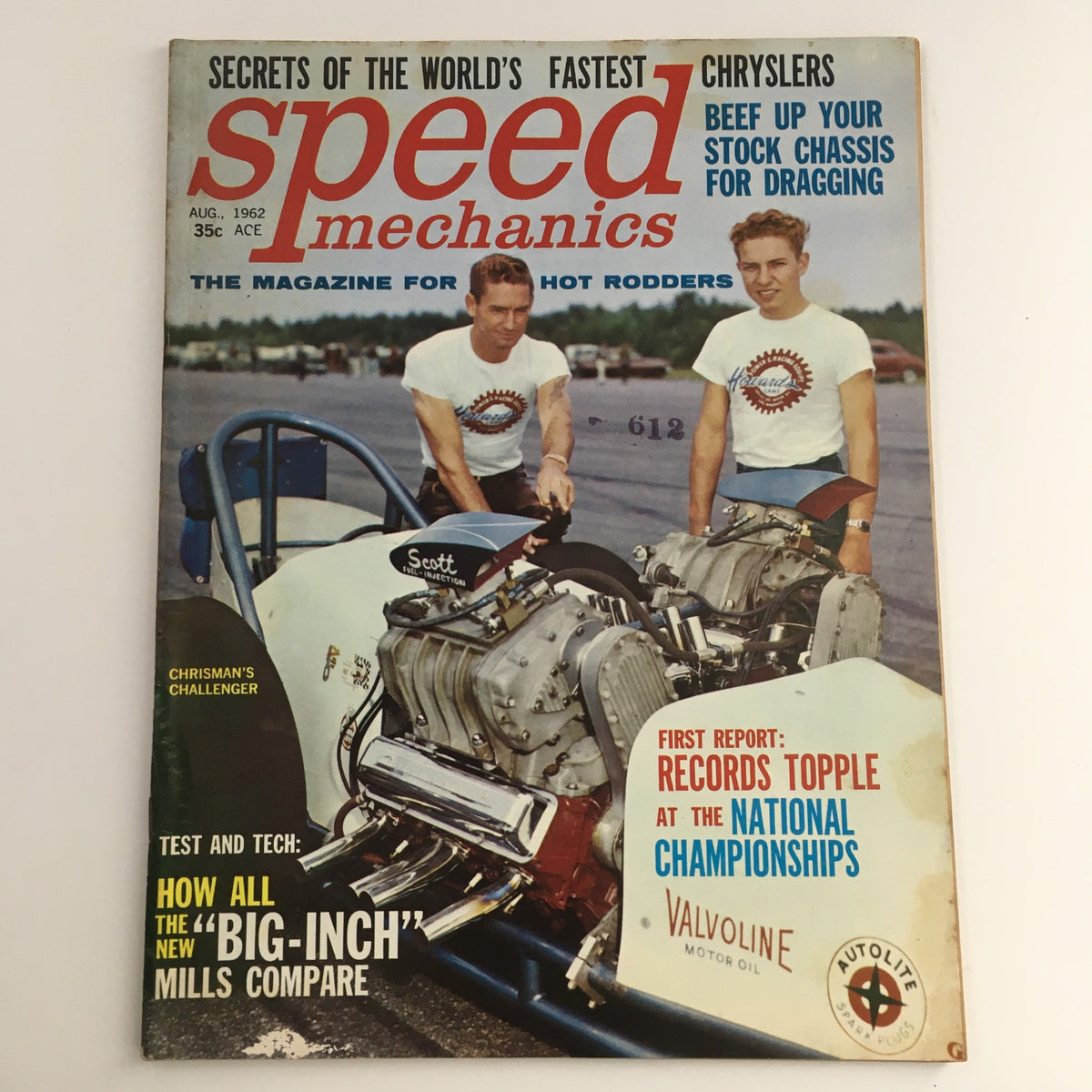 Cover of Speed Mechanics Magazine August 1962 featuring two men in racing shirts with a drag racing car, highlighting the 'Big Inch' mills comparison.