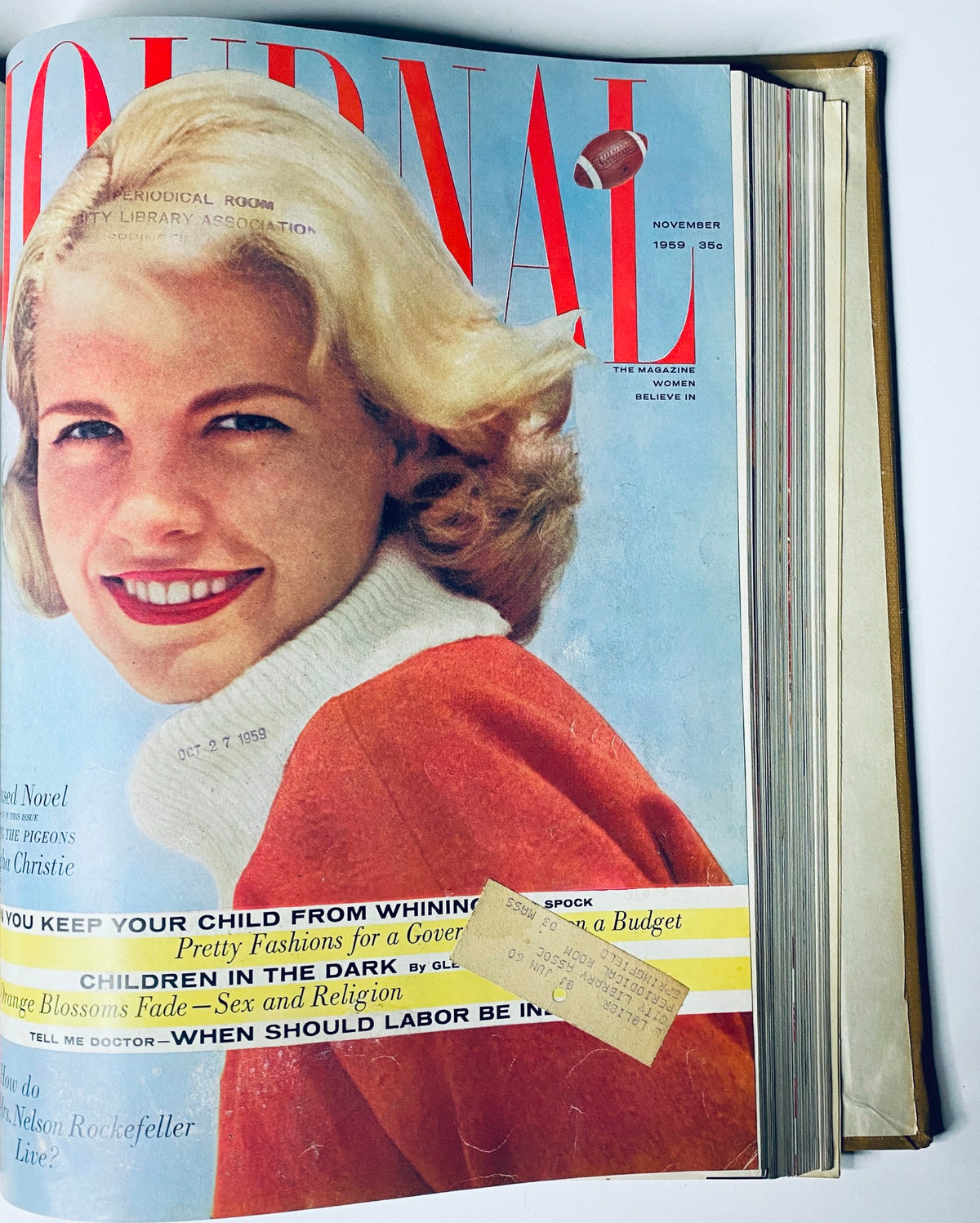 Cover of Ladies' Home Journal, November 1959 issue, showcasing a woman with blonde hair and a bright smile, focusing on children's issues and family advice.