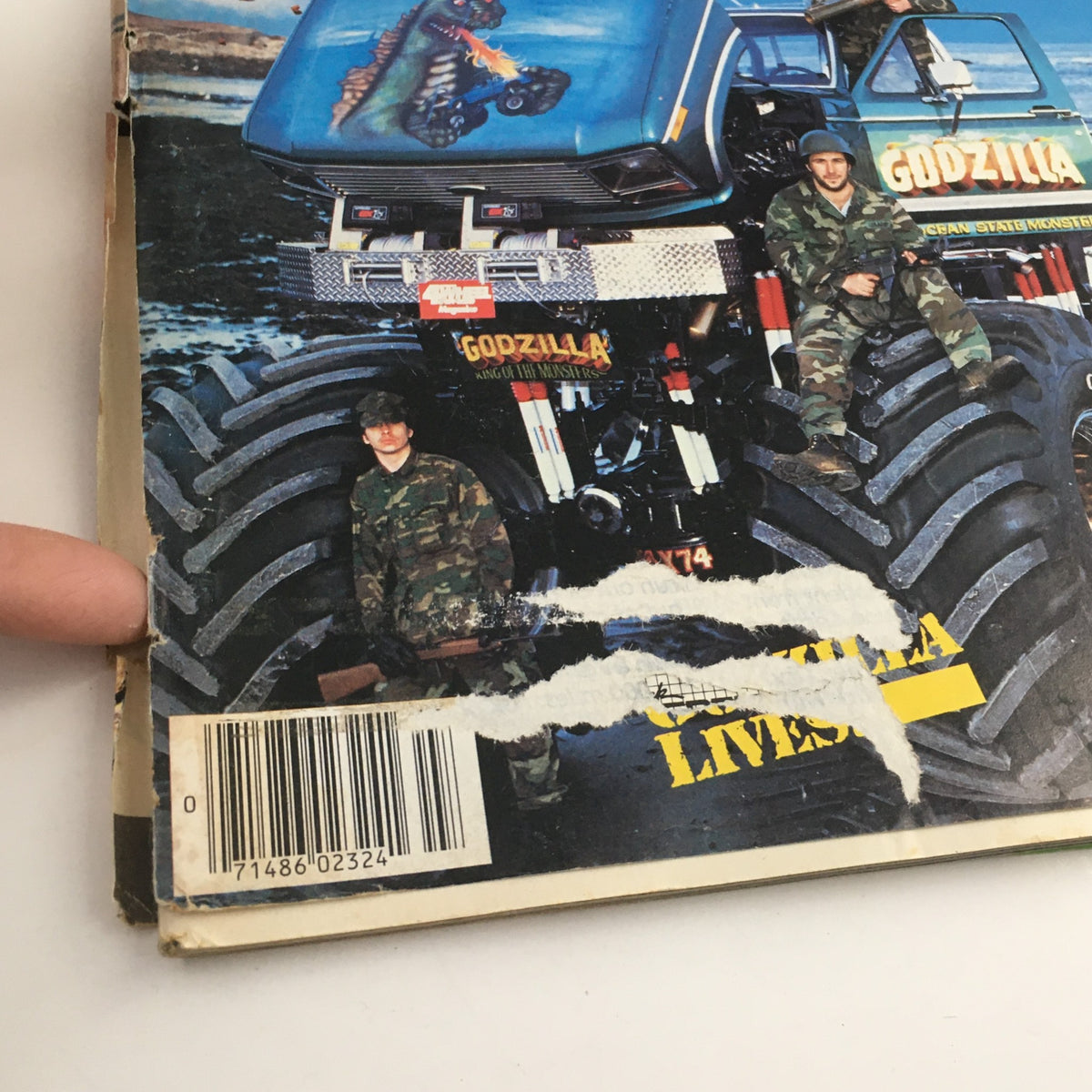Close-up of Petersen's 4 Wheel & Off-Road July 1985 magazine cover highlighting the giant monster truck Godzilla and details about the magazine's condition, including rips and a barcode.