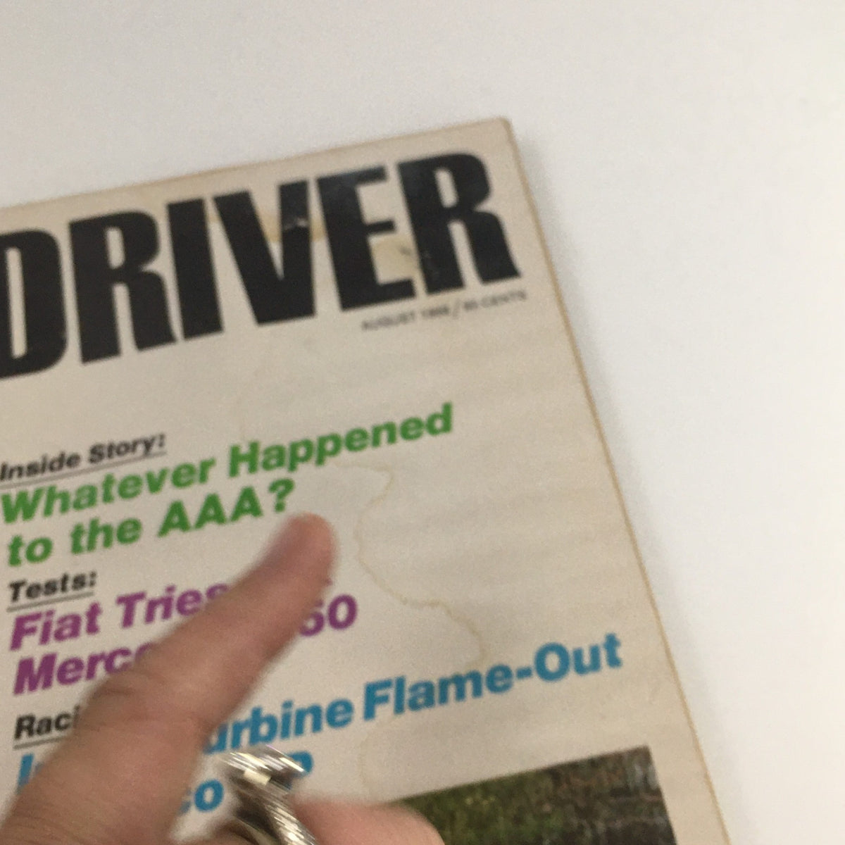Close-up view of Car and Driver Magazine August 1968 cover, showcasing articles on Fiat and Mercedes 250 tests and racing events.
