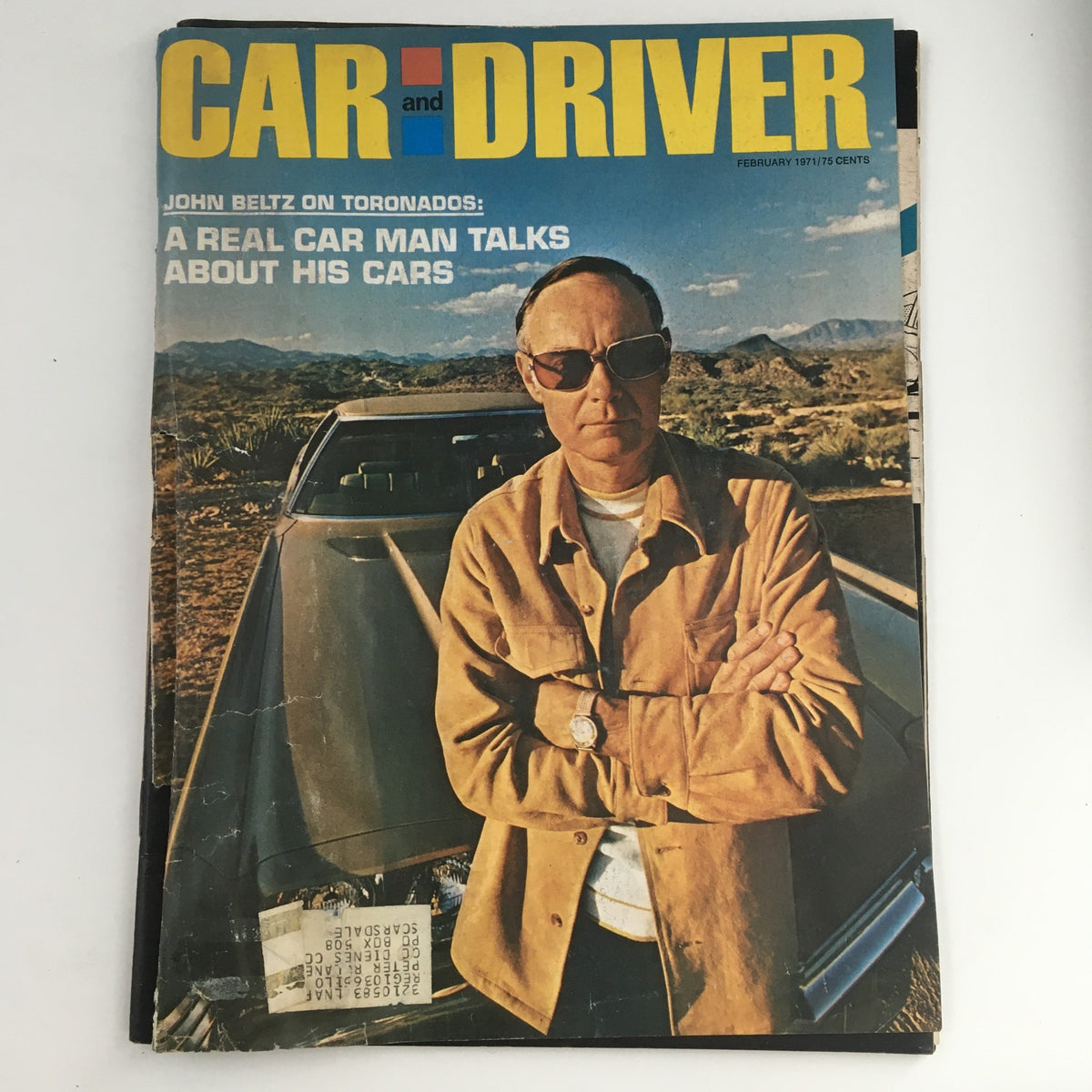 Cover of Car and Driver Magazine, February 1971, featuring John Beltz who talks about his Toronado cars, showcasing a desert landscape background.