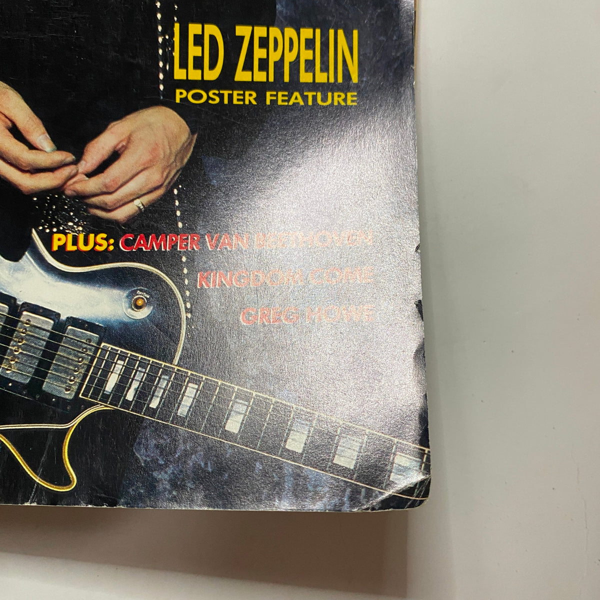 Close-up of Guitar for the Practicing Musician Magazine December 1988 showcasing Led Zeppelin poster feature.