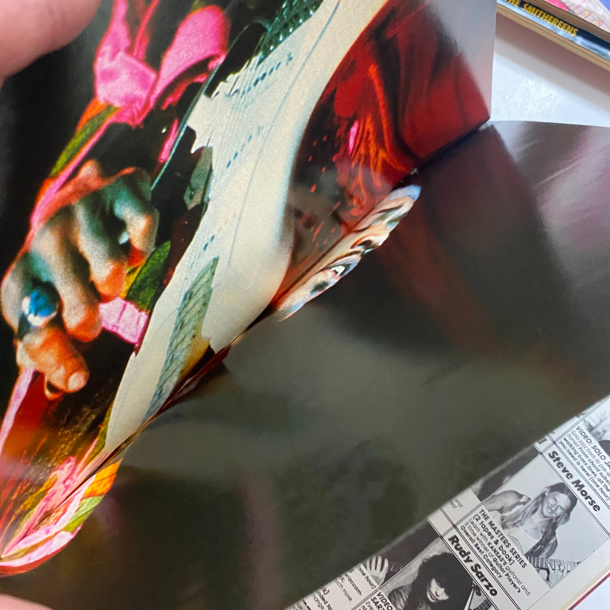 Inside view of the Guitar for the Practicing Musician Magazine, September 1987, showcasing a vivid image of Jimi Hendrix's hand on the guitar, highlighting the iconic poster included in the issue.