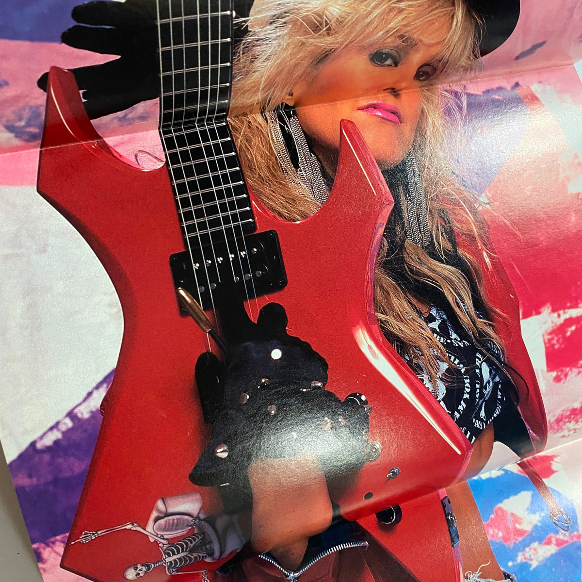 Guitar for the Practicing Musician Magazine July 1988 featuring a female guitarist holding a red electric guitar with a stylish outfit, showcasing a vibrant rock aesthetic.