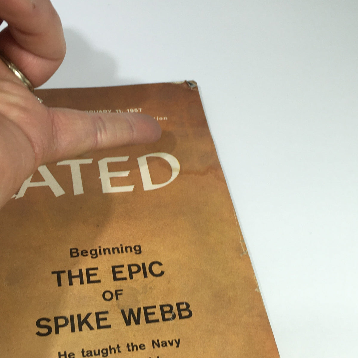 Top section of Sports Illustrated magazine February 11, 1957, showcasing the title 'Beginning THE EPIC OF SPIKE WEBB'.