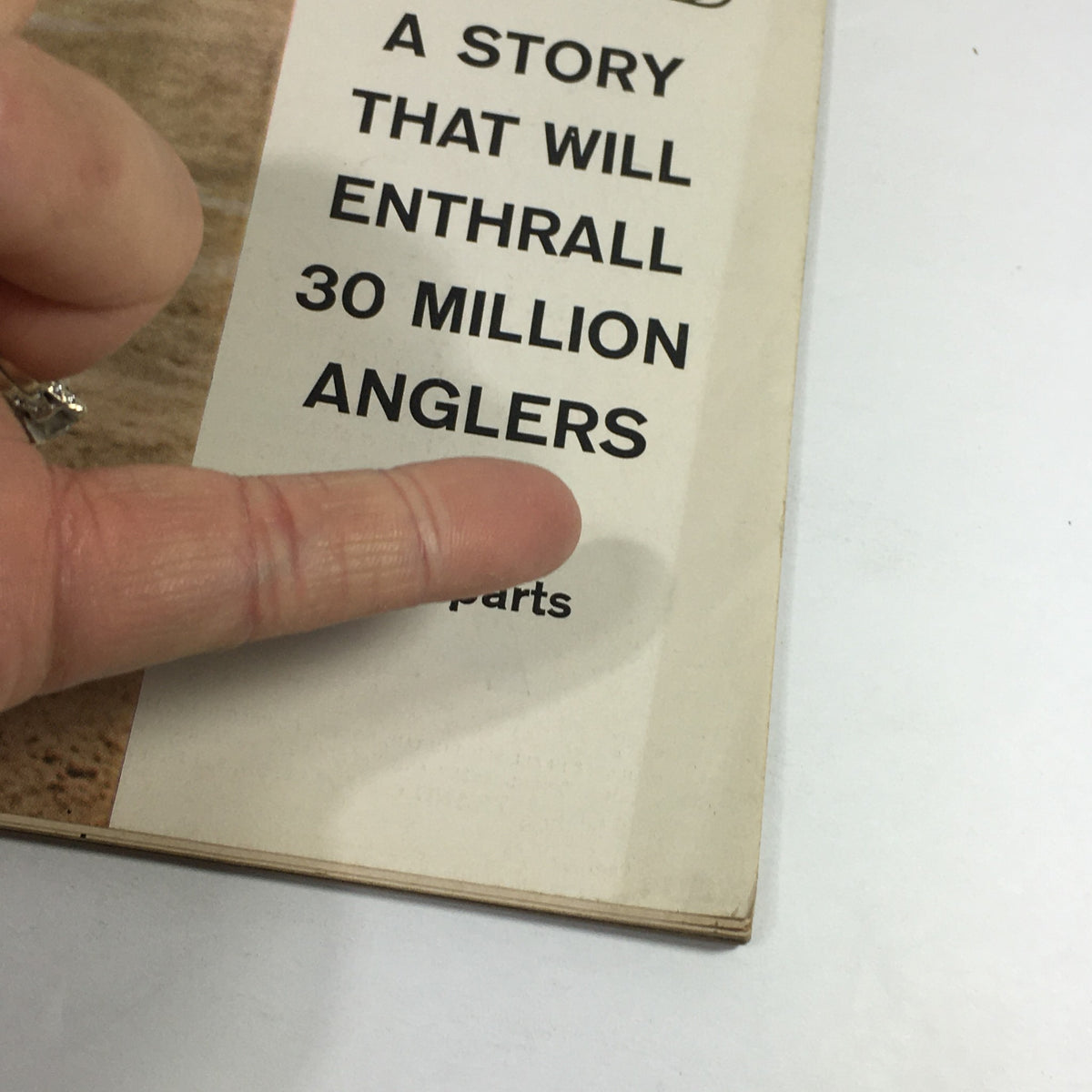 Close-up of the Sports Illustrated Magazine cover text from May 13, 1957, highlighting the story 'A Story That Will Enthrall 30 Million Anglers', next to Billy Pierce.