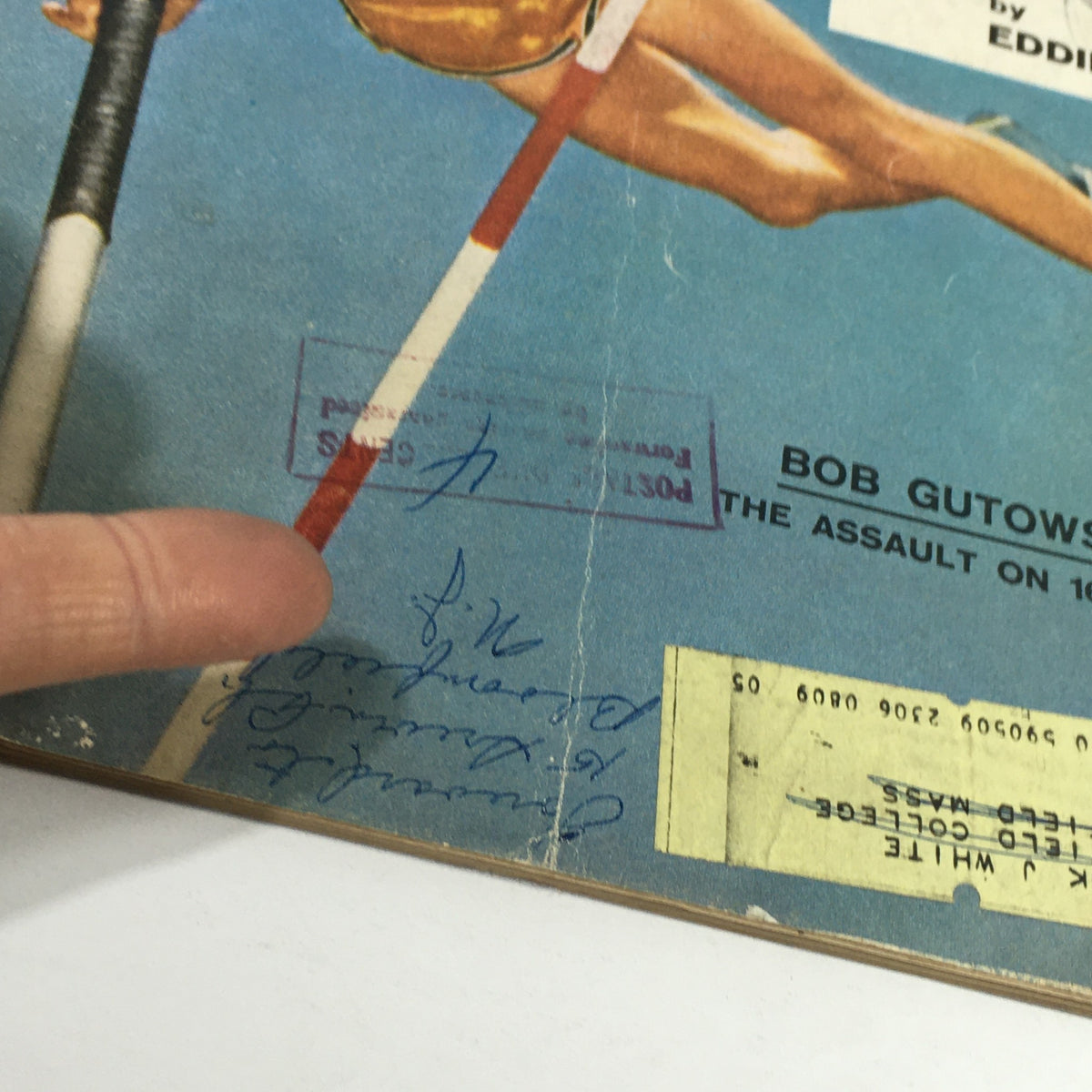 Close-up view featuring the vintage Sports Illustrated Magazine from June 24, 1957, highlighting Bob Gutowski, with visible address label and handwritten notes on the cover.