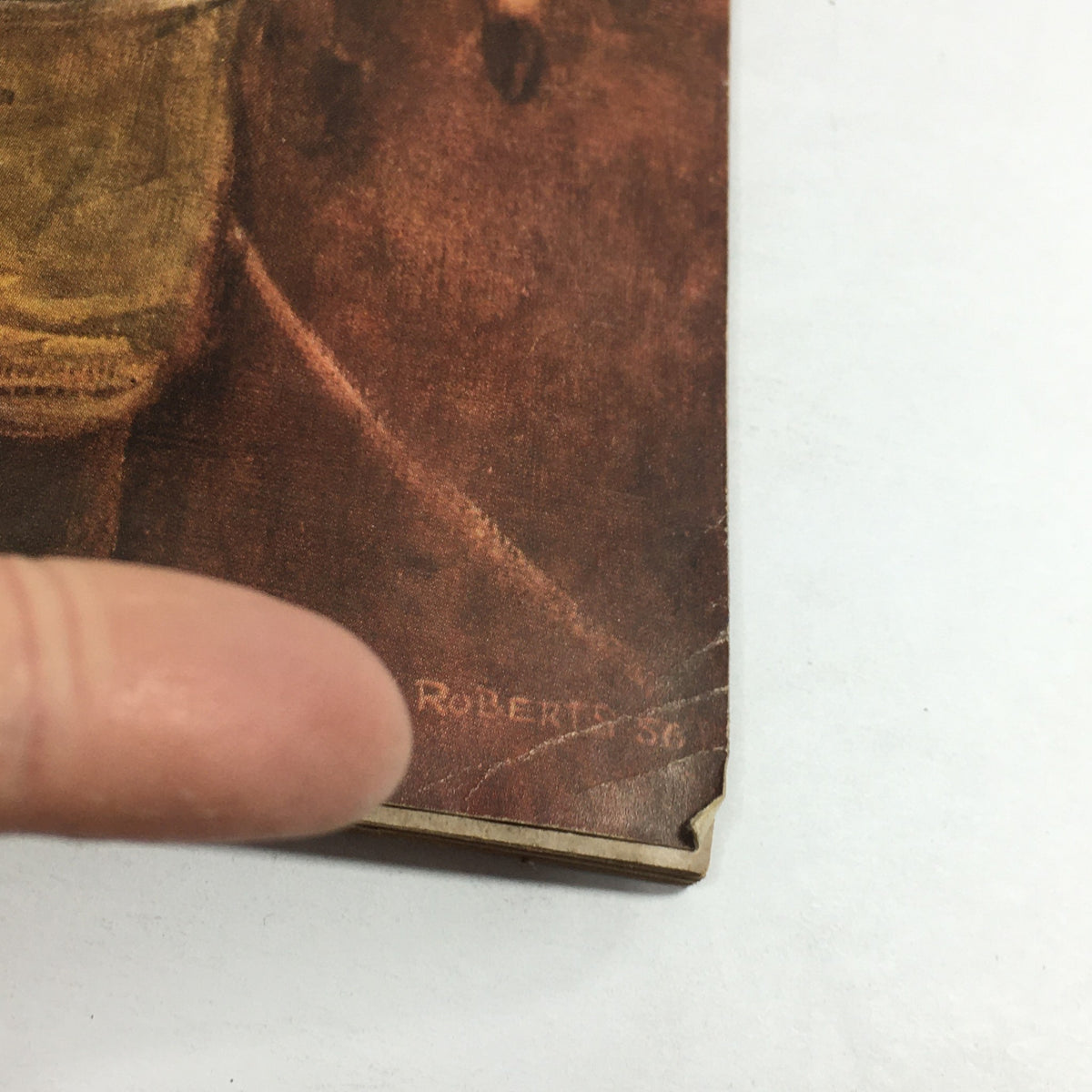 Detail of the signature from Morton Roberts on the cover of the Vintage Sports Illustrated Magazine December 10 1956, indicating the artist of the cover art.