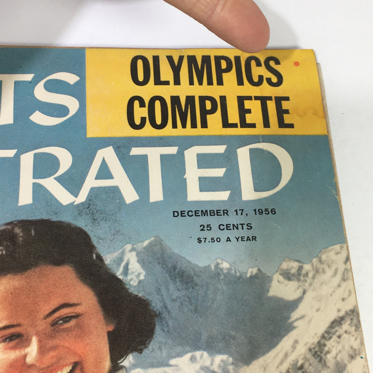 Cover of Sports Illustrated Magazine December 17, 1956, featuring Elizabeth Guest, showcasing a vintage design with mountains and a background, highlighting the nostalgic appeal of mid-20th century sports journalism.