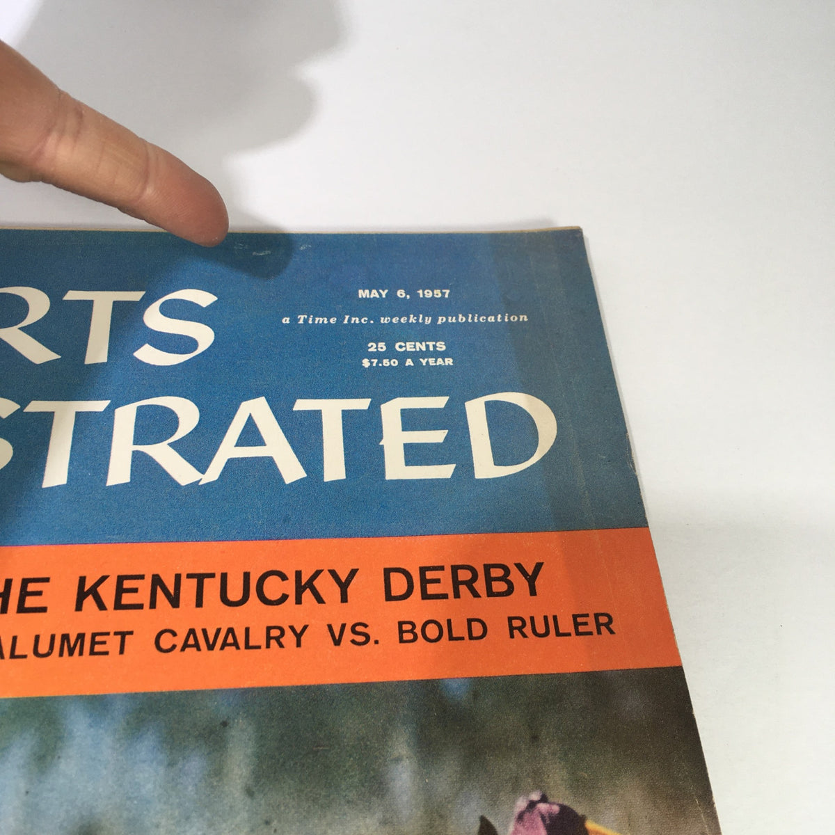 Vintage Sports Illustrated Magazine cover from May 6, 1957, featuring Calumet Cavalry vs Bold Ruler, highlighting the Kentucky Derby, with a prominent display of the magazine title and issue date.
