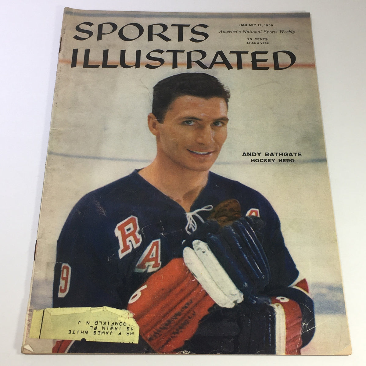 Vintage Sports Illustrated magazine cover from January 12, 1959, featuring Andy Bathgate, a legendary hockey hero, showcasing a captivating image of him holding hockey gear.